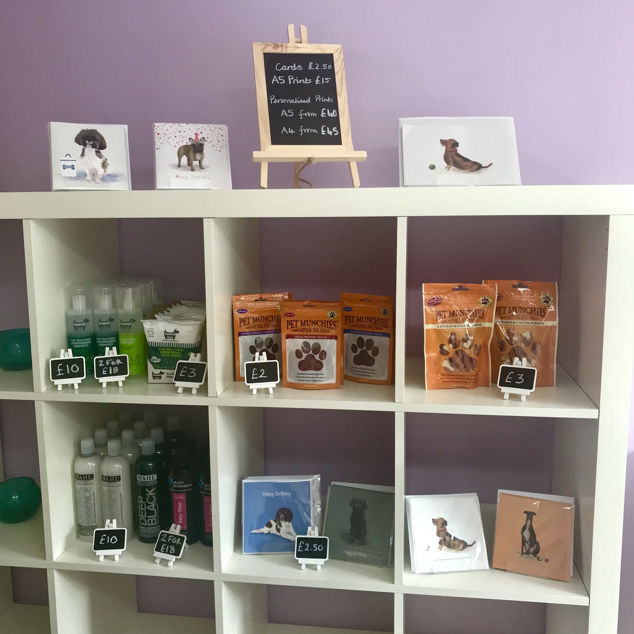 Shelves of dog treats, shampoos and greetings cards in the Hairy Tails shop